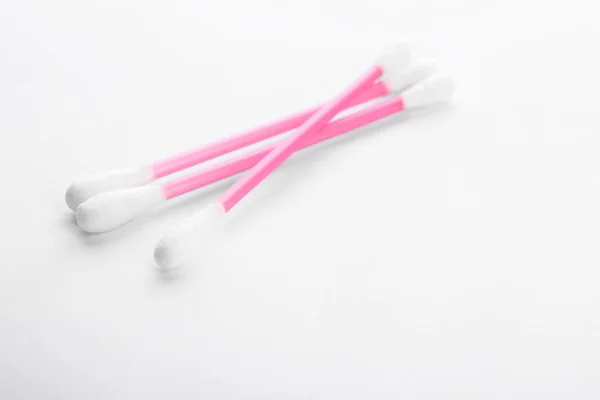 Pink plastic cotton swabs on white background — Stock Photo, Image