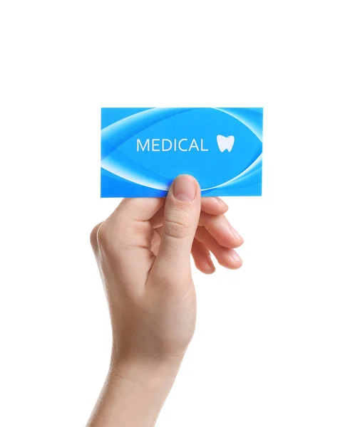 Mulher segurando cartão de visita isolado em branco, close-up. Serviço médico odontológico — Fotografia de Stock