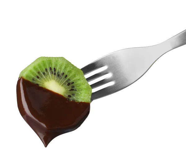 Kiwi with chocolate on fondue fork against white background — Stock Photo, Image