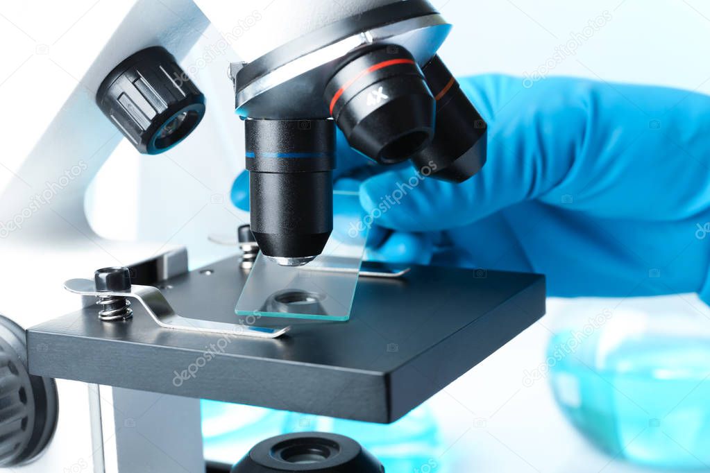 Scientist working with modern microscope, closeup. Chemical research