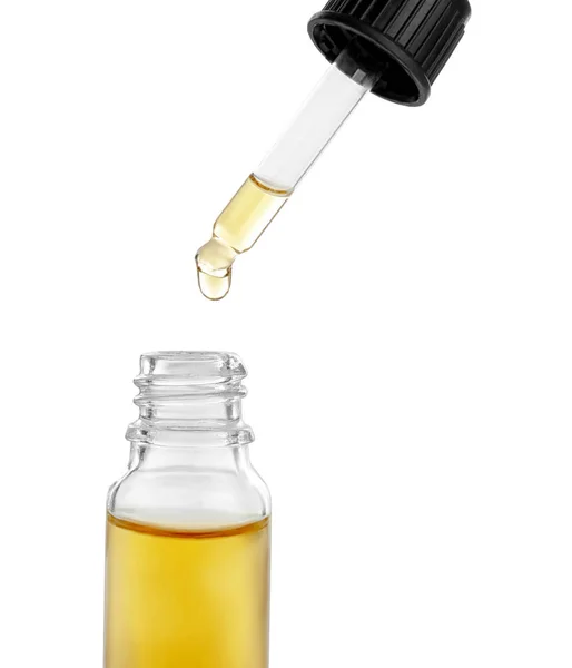 Fläschchen mit ätherischem Öl und Tropfer auf weißem Hintergrund — Stockfoto