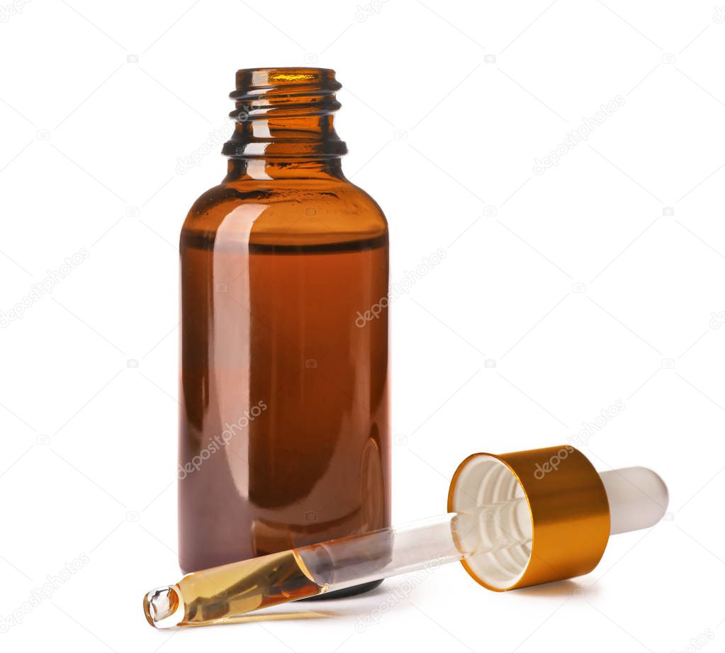 Cosmetic bottle and pipette with essential oil on white background