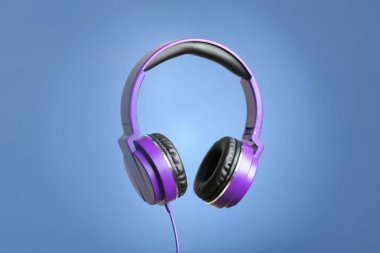 Renkli arka planda pedleri olan şık kulaklıklar