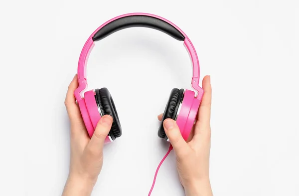 Woman holding stylish headphones on white background, closeup — Stock fotografie