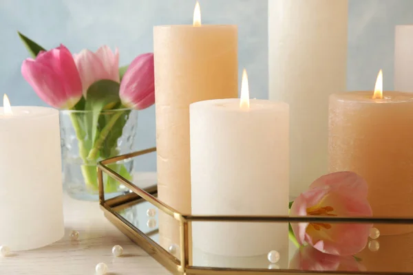 Composition with burning candles on table, closeup — Stock Photo, Image