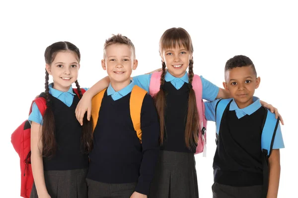 Retrato de crianças bonitos em uniforme escolar no fundo branco — Fotografia de Stock