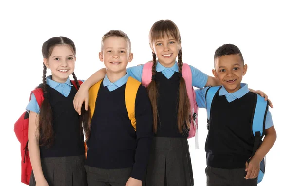 Retrato de crianças bonitos em uniforme escolar no fundo branco — Fotografia de Stock