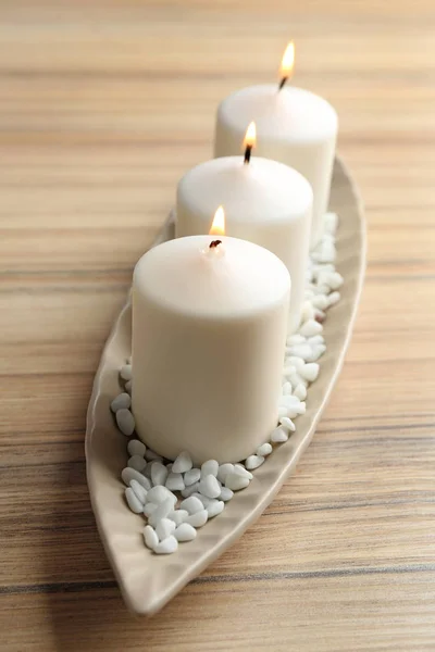 Composición con tres velas sobre mesa de madera —  Fotos de Stock