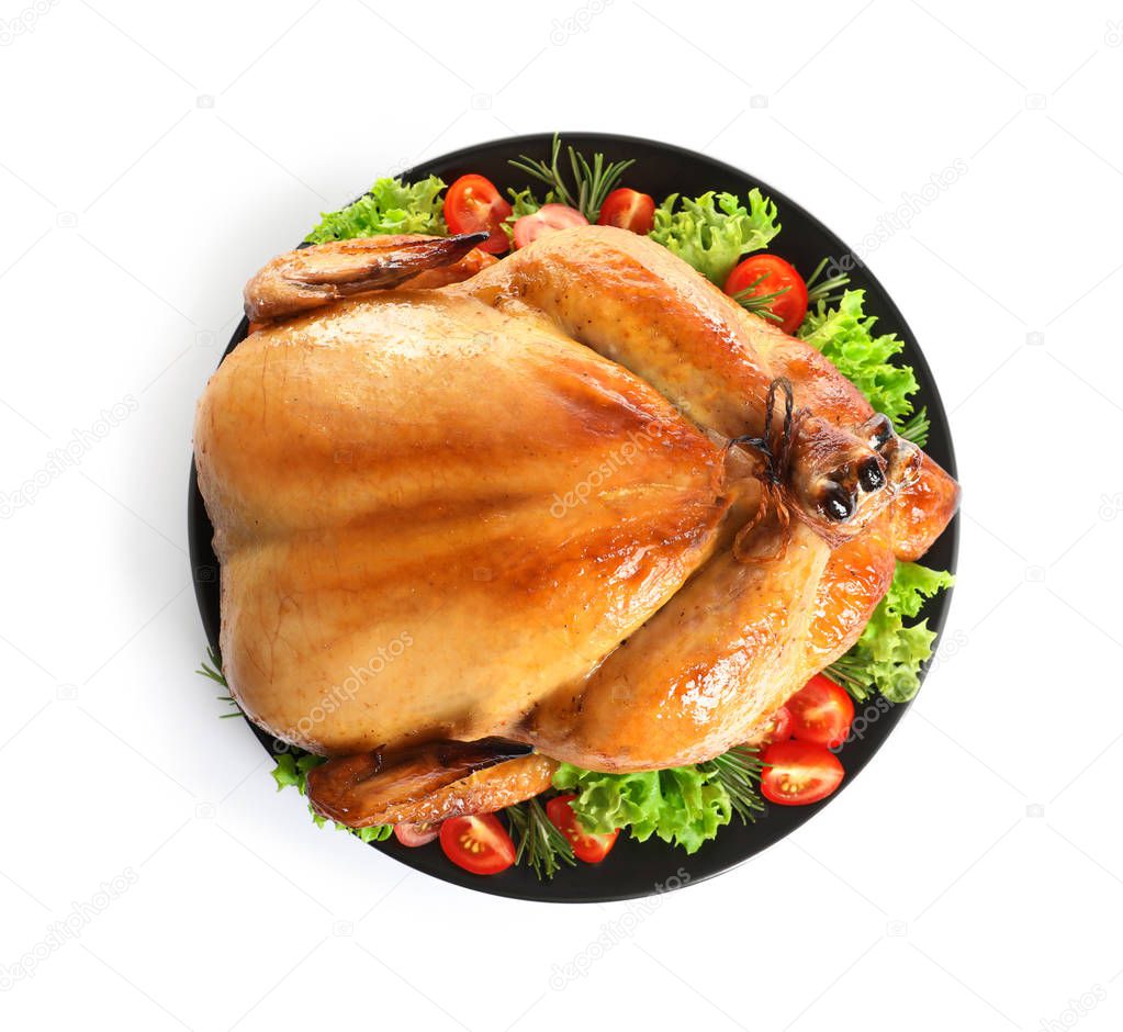 Platter of cooked turkey with garnish on white background, top view