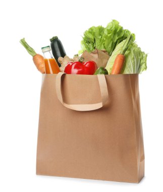Paper bag with vegetables and bottle of juice on white background clipart