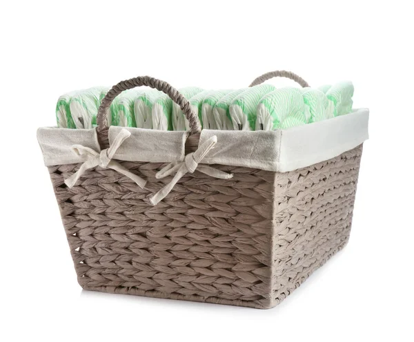 Basket with diapers on white background. Baby accessories — Stock Photo, Image