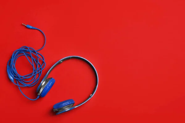 Stylish headphones on color background, top view. Space for text — Stock Photo, Image