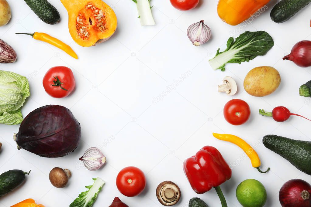 Frame made of fresh ripe vegetables on white background, flat lay. Space for text