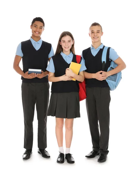 Full längd porträtt av tonåringar i skoluniform på vit bakgrund — Stockfoto