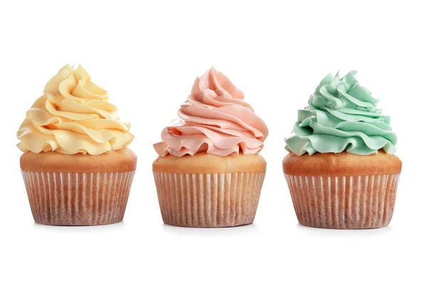 Delicious cupcakes with cream on white background — Stock Photo, Image