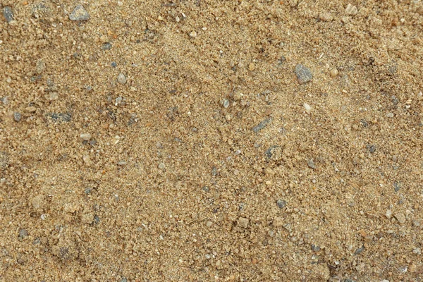 Teksturowana piaszczysta powierzchnia gleby jako tło, widok z góry — Zdjęcie stockowe