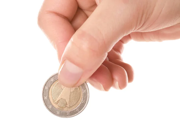 Woman holding coin in hand on white background, closeup — Stock Photo, Image