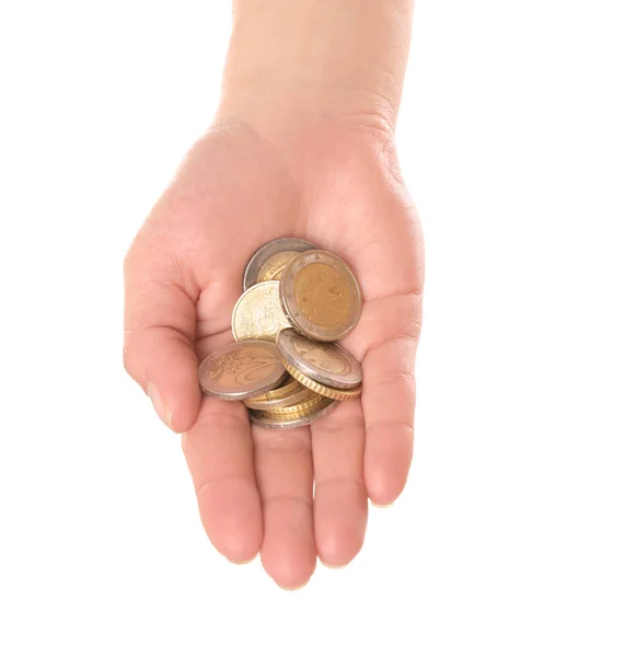 Mujer sosteniendo monedas en la mano sobre fondo blanco, primer plano — Foto de Stock
