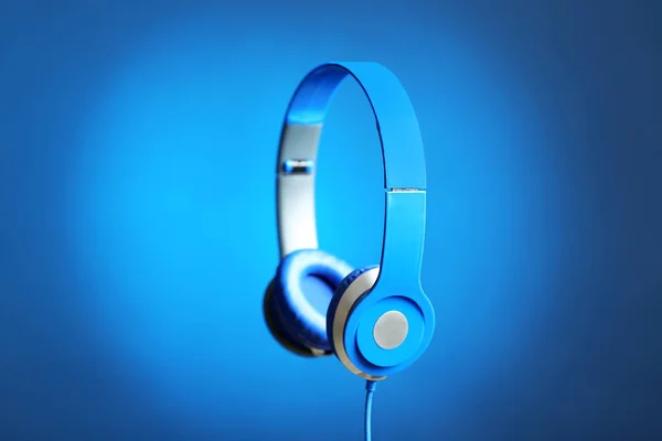 Stylish headphones with pads on color background — Stock Photo, Image