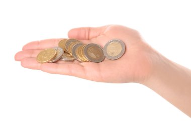 Woman holding coins in hand on white background, closeup