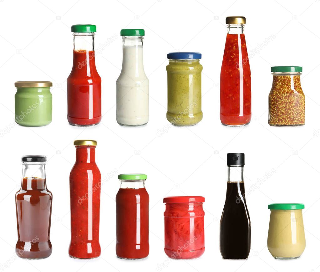 Set of glassware with different delicious sauces on white background