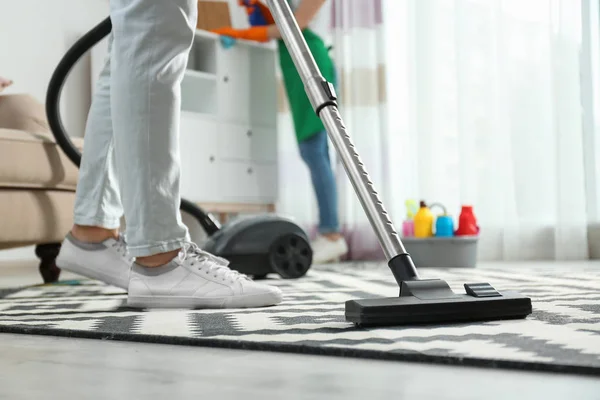 Cleaning service professional vacuuming carpet indoors, closeup — Stock Photo, Image