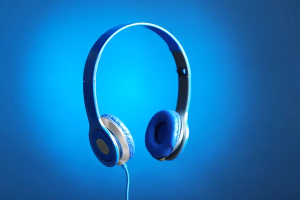 Stylish headphones with pads on color background — Stock Photo, Image