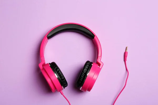 Stylish headphones on color background, top view — Stock Photo, Image