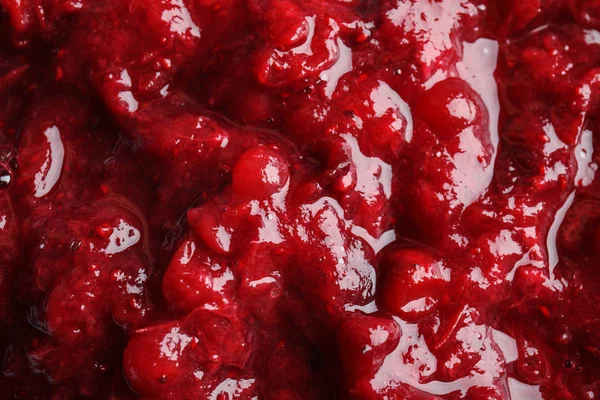 Molho de cranberry saboroso como fundo, vista close-up — Fotografia de Stock