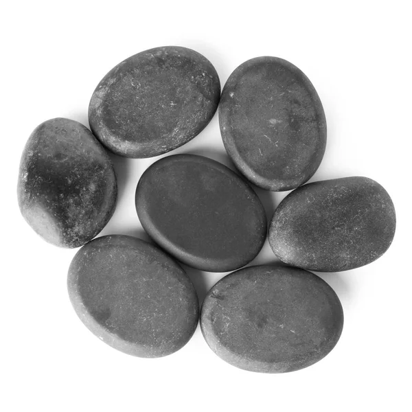 Černé lázeňské kameny na bílém pozadí, pohled shora — Stock fotografie
