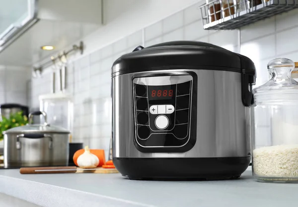 Modern multi cooker on table in kitchen. Space for text — Stock Photo, Image