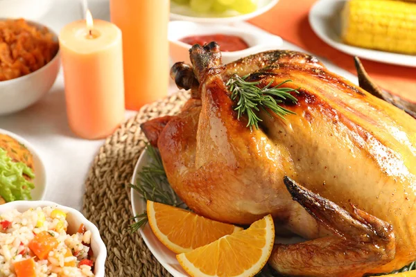 Delicious roasted turkey with garnish on dinner table