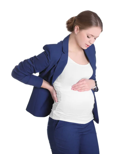 Young pregnant woman suffering from pain on white background. Working while expecting baby — Stock Photo, Image