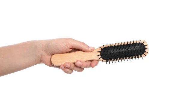 Woman holding hair brush on white background, closeup — Stock Photo, Image