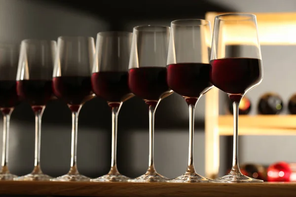 Glasses of red wine in cellar. Expensive drink — Stock Photo, Image