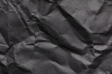 Arka plan olarak siyah buruşturulmuş kağıt levha. Tasarım alanı