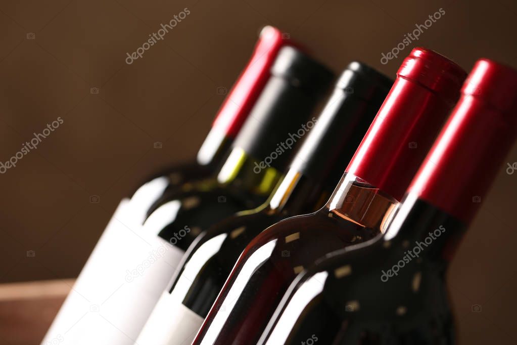 Bottles of different wines, closeup. Expensive collection