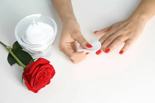 Woman removing nail polish on white background, view from above — 스톡 사진