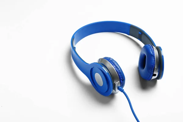 Stylish modern headphones with wire on white background — Stock Photo, Image