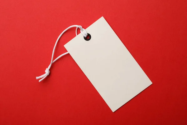 Cardboard tag with space for text on color background, top view