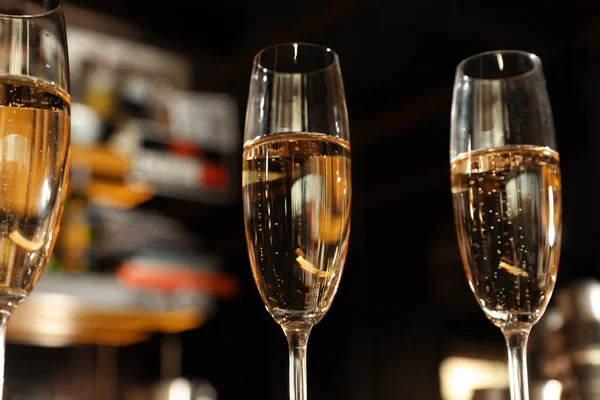 Glasses of champagne in bar, low angle view