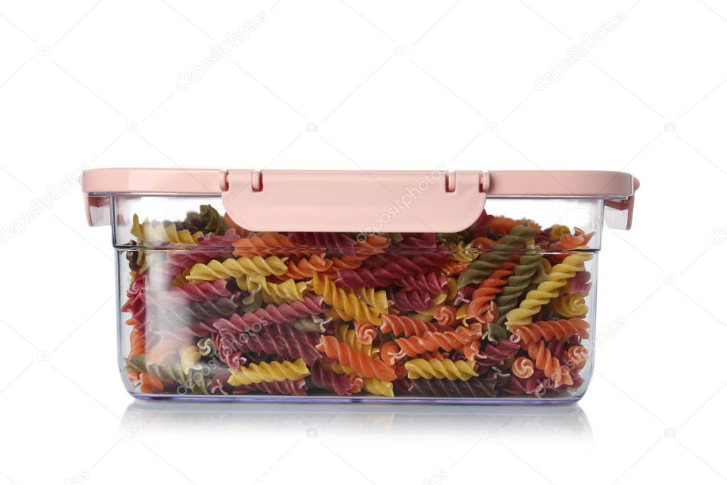 Box with uncooked pasta on white background