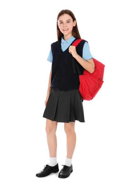Full längd porträtt av tonårs flicka i skoluniform med ryggsäck på vit bakgrund — Stockfoto