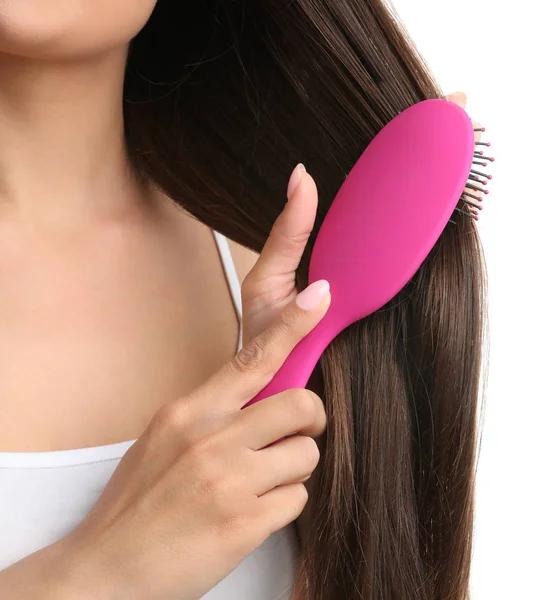 Woman with hair brush on white background, closeup — Stock Photo, Image