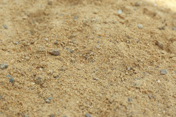 Teksturowana piaszczysta powierzchnia gleby jako tło, zbliżenie — Zdjęcie stockowe