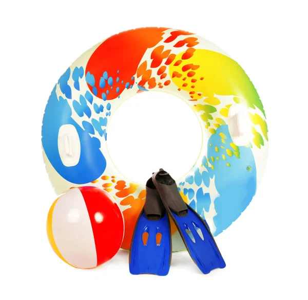 Bright inflatable ring, beach ball and flippers on white background — Stock Photo, Image