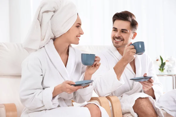 Romantic young couple with tea in spa salon — Stock Photo, Image