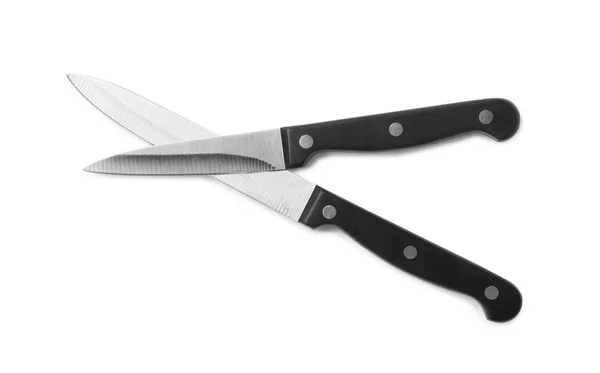 Rozsdamentes acél kések fehér háttérrel, felülnézet — Stock Fotó