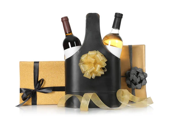 Festive package with bottles of wine and gift boxes on white background