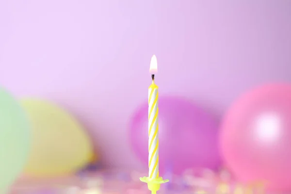 Burning birthday cake candle on color background. Space for text — Stock Photo, Image